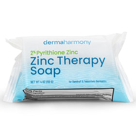 Dermaharmony bar being applied to scalp under shower for targeted flake control