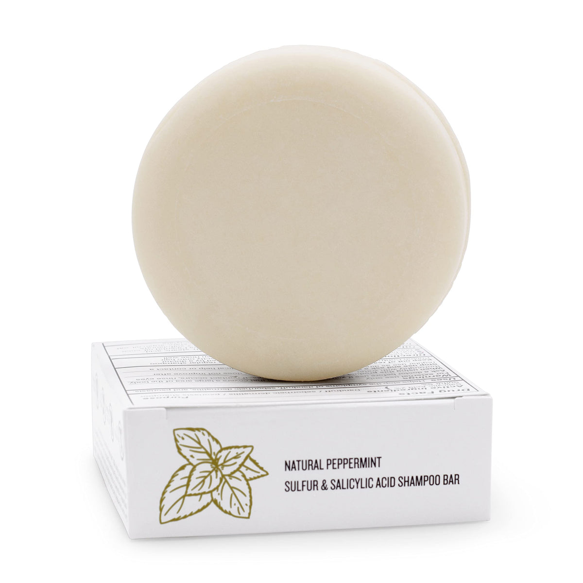 Dermaharmony shampoo bar beside a coin for 4 oz size and travel convenience