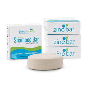 Dermaharmony shampoo bar rubbed into wet hair demonstrating application