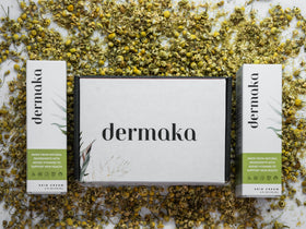 Dermaka 4 oz tube next to common items to show compact travel size