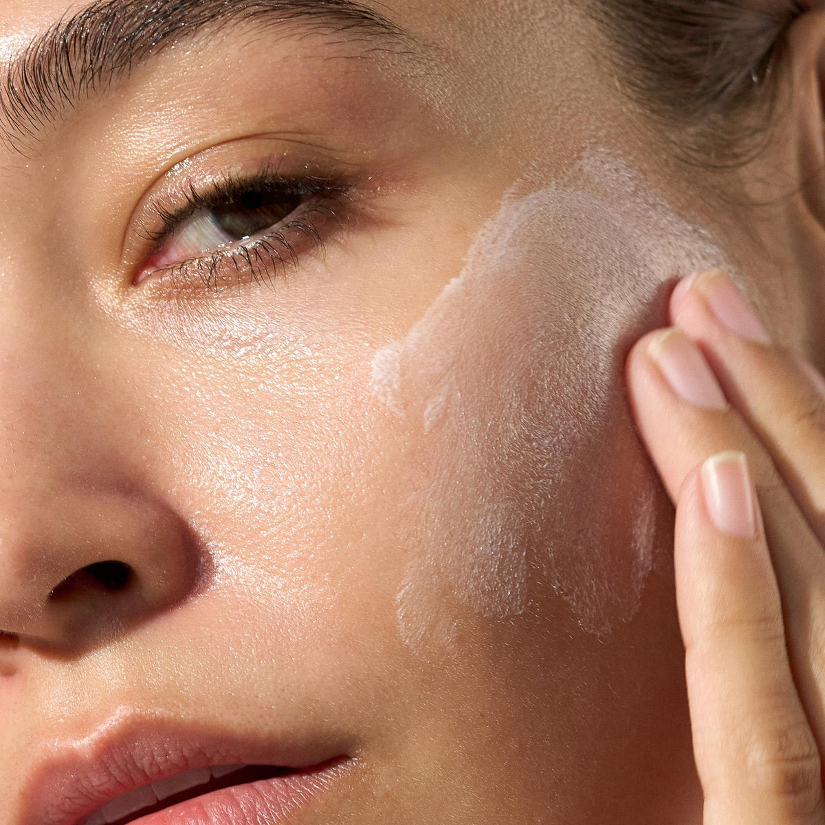 Dermalogica cream blended on cheek illustrating quick absorption and a perfected look