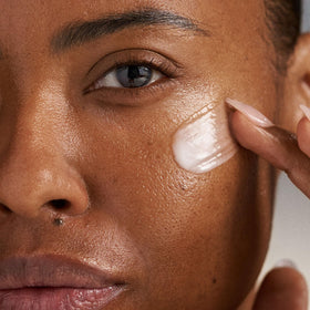 Dermalogica morning routine lifestyle shot showing serum use before sunscreen