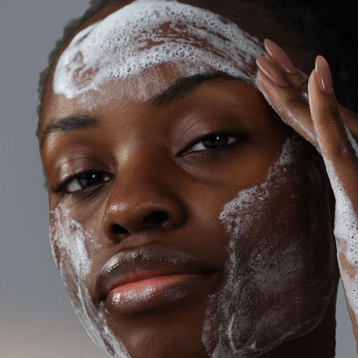 Dermalogica close-up of microfoliant cream texture polishing skin for smoother tone