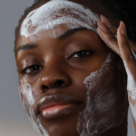 Dermalogica close-up of microfoliant cream texture polishing skin for smoother tone