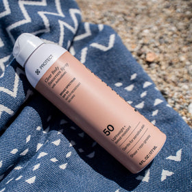 Dermasport 6 oz can next to sunglasses for size and travel convenience