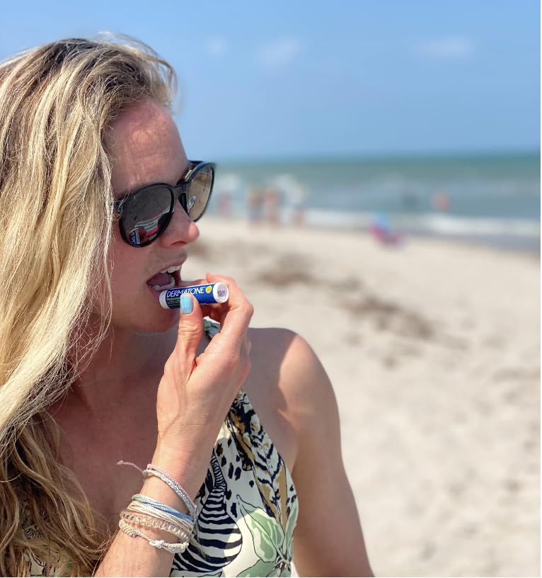 DERMATONE lip balm applied outdoors protecting lips during sun exposure