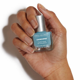 Dermelect Launchpad brush and cap detail demonstrating easy application and precise control