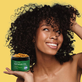 Close-up of Dersie batana butter texture revealing rich paste and moisturizing benefit