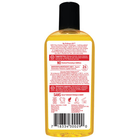 Drop of Desert Essence jojoba oil on hand showing lightweight texture and quick absorption