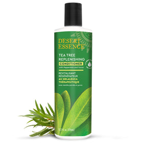 Desert Essence label close-up highlighting key ingredients for scalp care