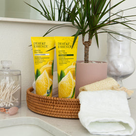 Desert Essence on bathroom shelf in lifestyle setting showing clean routine benefit