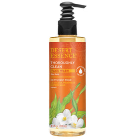 Desert Essence bottle in natural outdoor setting conveying sustainably sourced botanicals