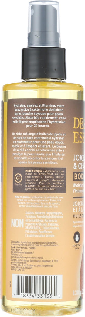 Hand holding Desert Essence bottle to show actual 8.28 fl oz size and portability