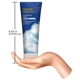 Desert Essence bottle held in hand to show 8 fl oz size and scale