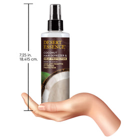 Desert Essence 8 fl oz bottle held in hand to show scale