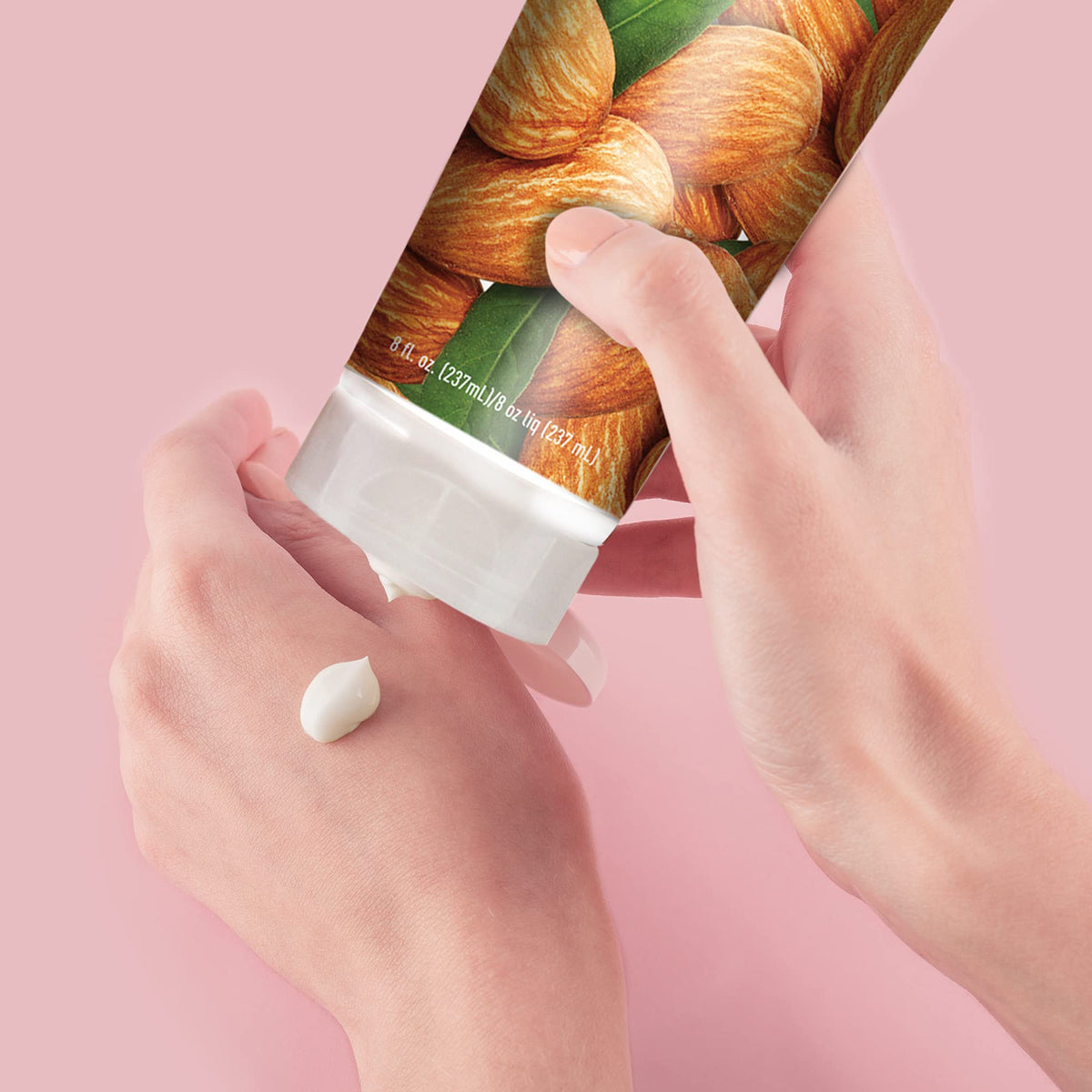 Desert Essence 8 oz bottle held in hand showing size and portability benefit