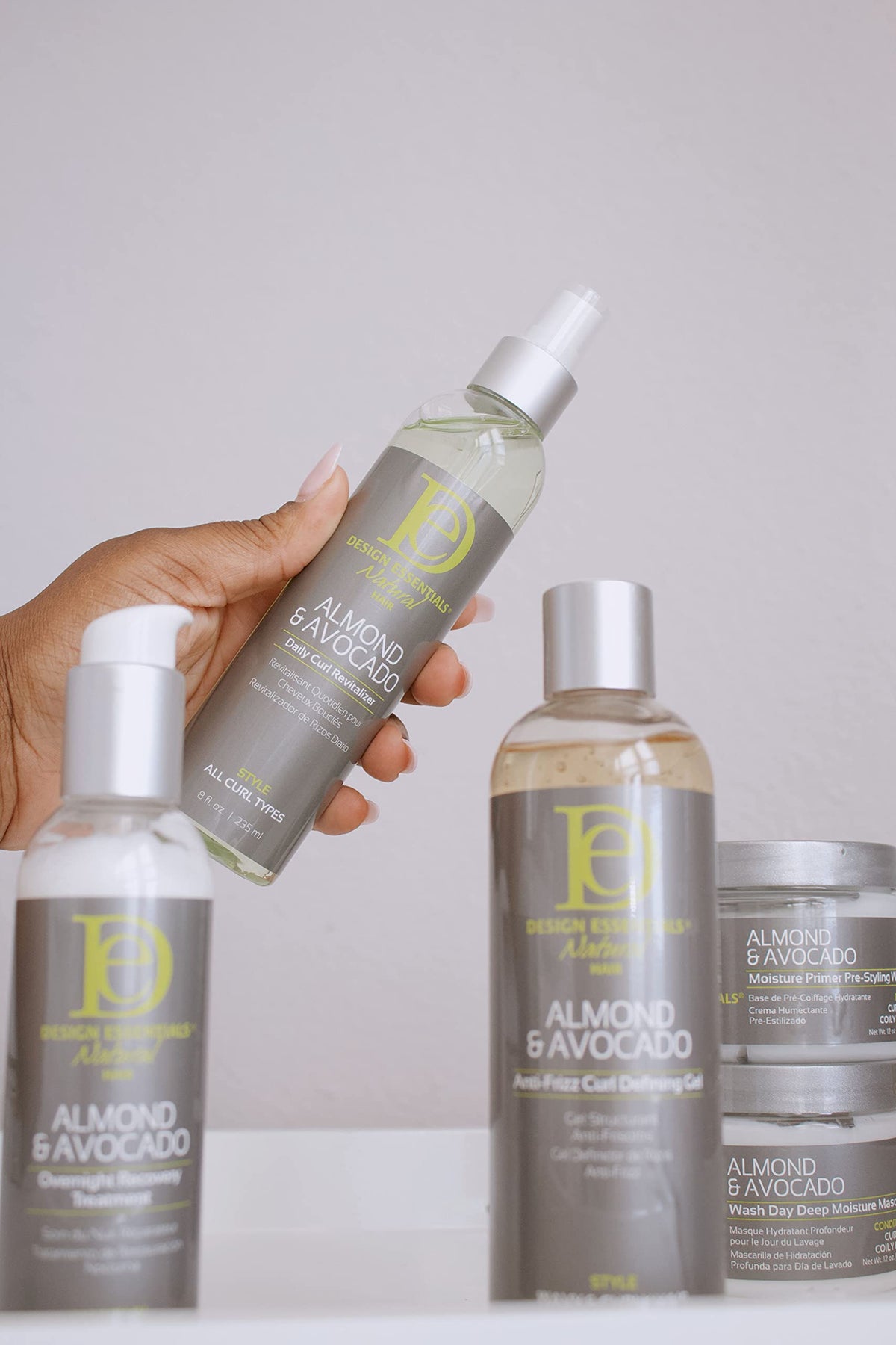 Design Essentials spray nozzle dispensing revitalizer onto dry curls, fast refresh benefit