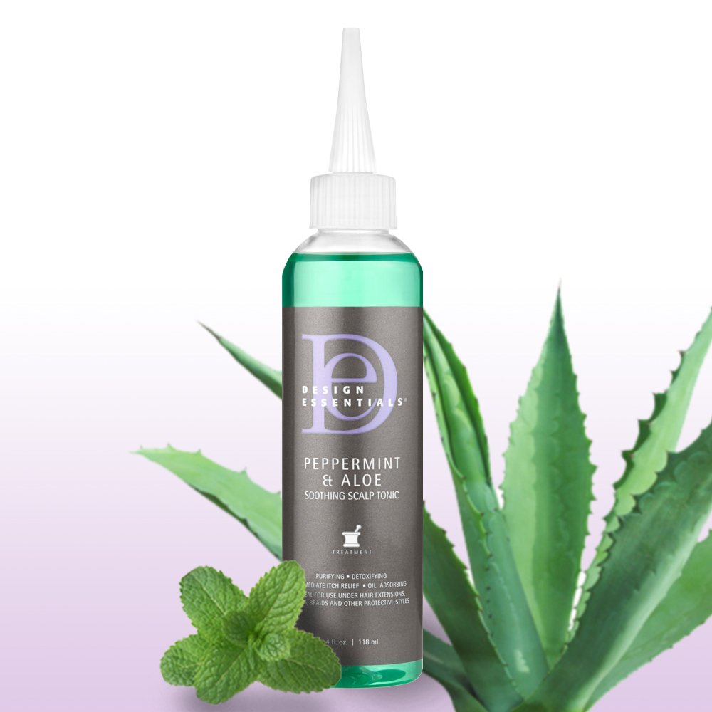Design Essentials 4 oz bottle next to a common object to show compact travel-friendly size