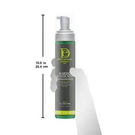 Design Essentials 10 oz bottle in hand to show size and travel convenience