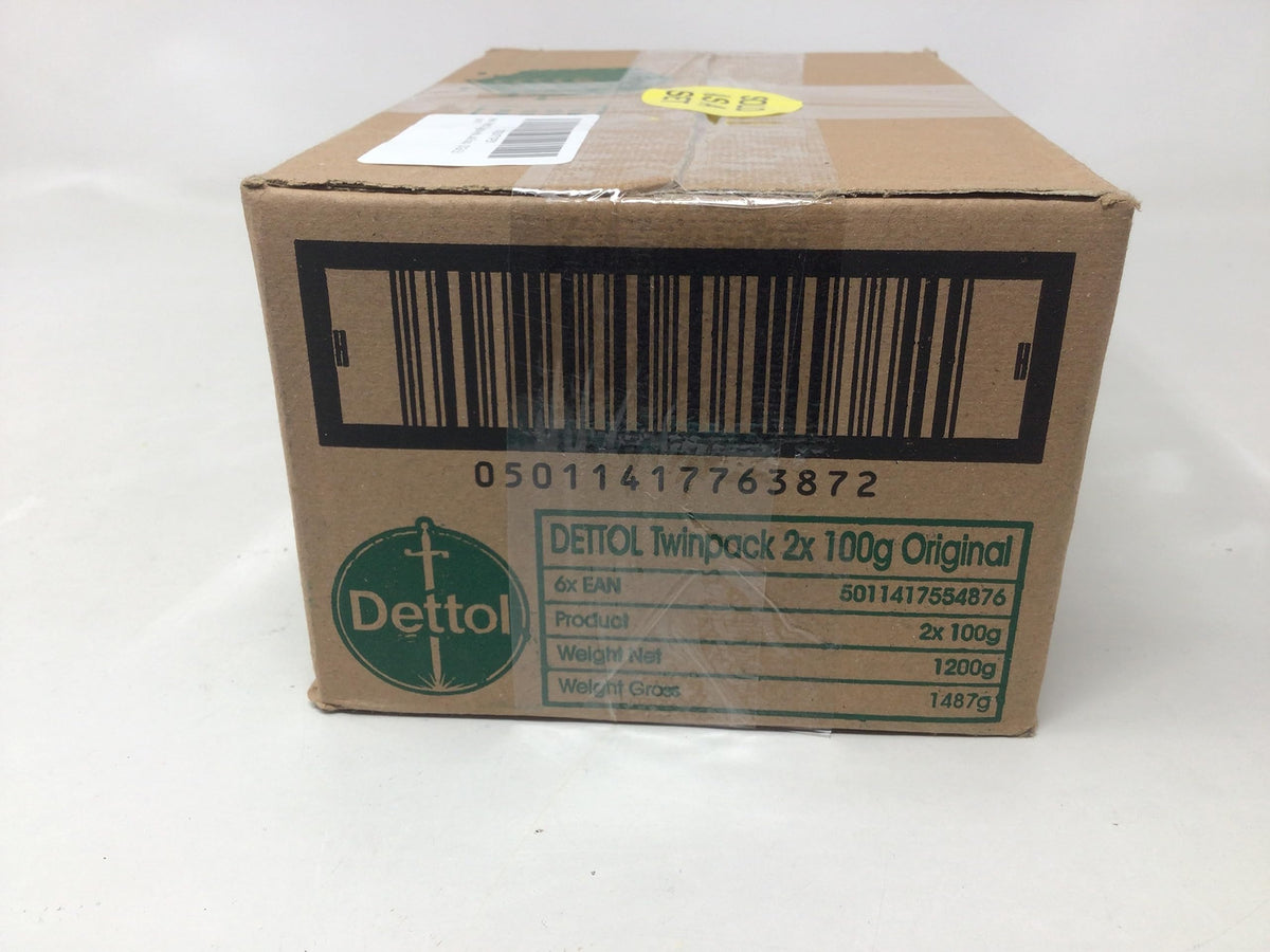Dettol bar beside a ruler showing 100 g (3.5 oz) scale clarity