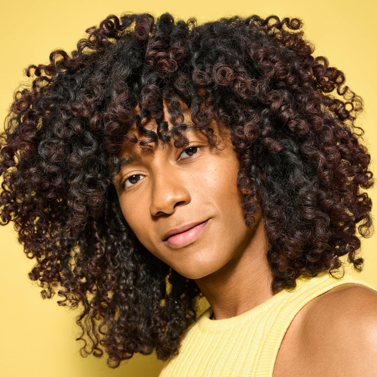 DevaCurl texture close-up showing creamy formula for easy detangling
