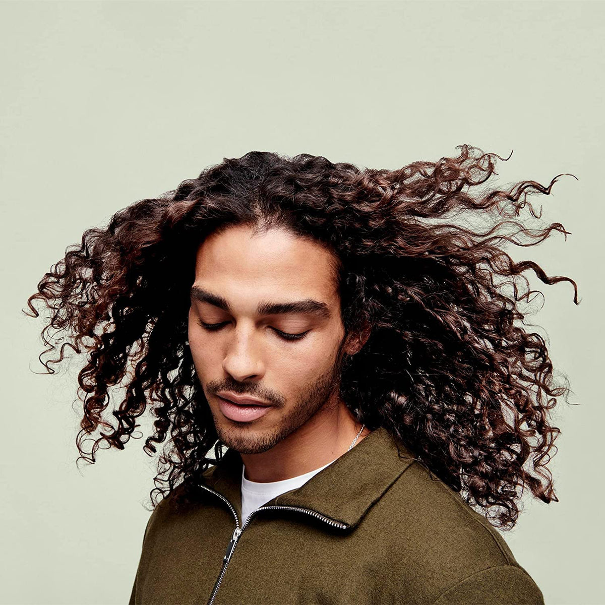 DevaCurl 32 fl oz bottle beside common items showing size and value benefit