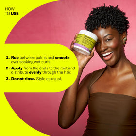 DevaCurl cream in hand being applied to hair for easy, even distribution