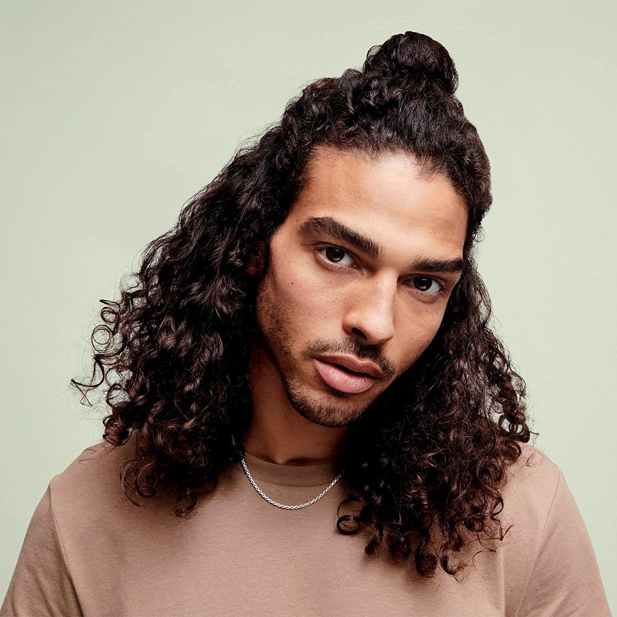 DevaCurl 32 fl oz bottle beside common items to illustrate size and value
