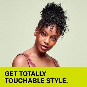 DevaCurl being applied to damp curls demonstrating even distribution and curl definition