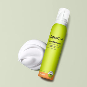 DevaCurl SuperMousse foam texture close-up demonstrating airy, buttery consistency for lightweight volume