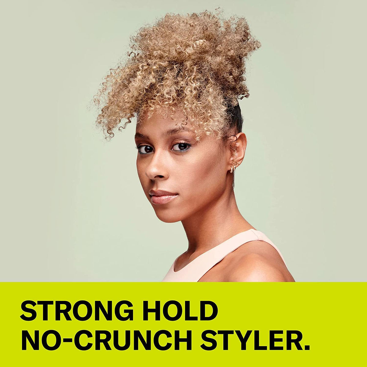 DevaCurl gel held in hand to show 12 fl oz size and portability for travel and daily use