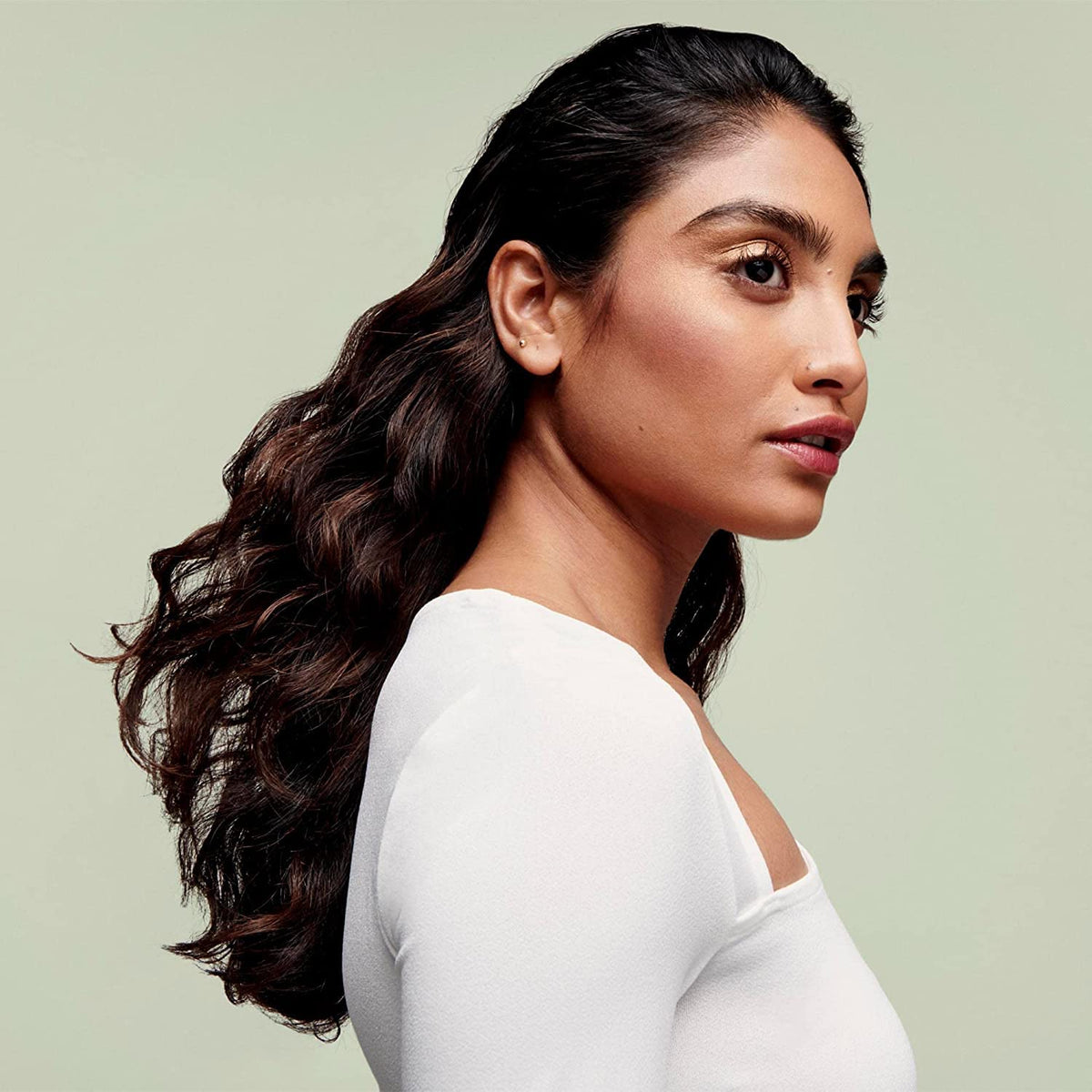 DevaCurl applied to damp hair illustrating clumping and frizz control