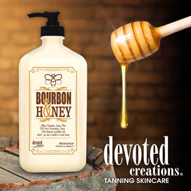 Devoted Creations bourbon & honey jar held in hand to show 18.25 oz scale and value