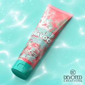 Devoted Creations lotion texture close-up showing smooth, lightweight formula for fast absorption