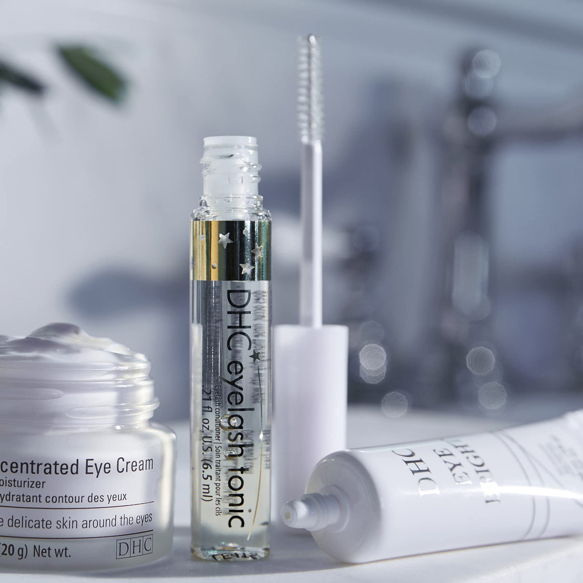 DHC eyelash tonic clear gel texture closeup showing smooth lightweight formula