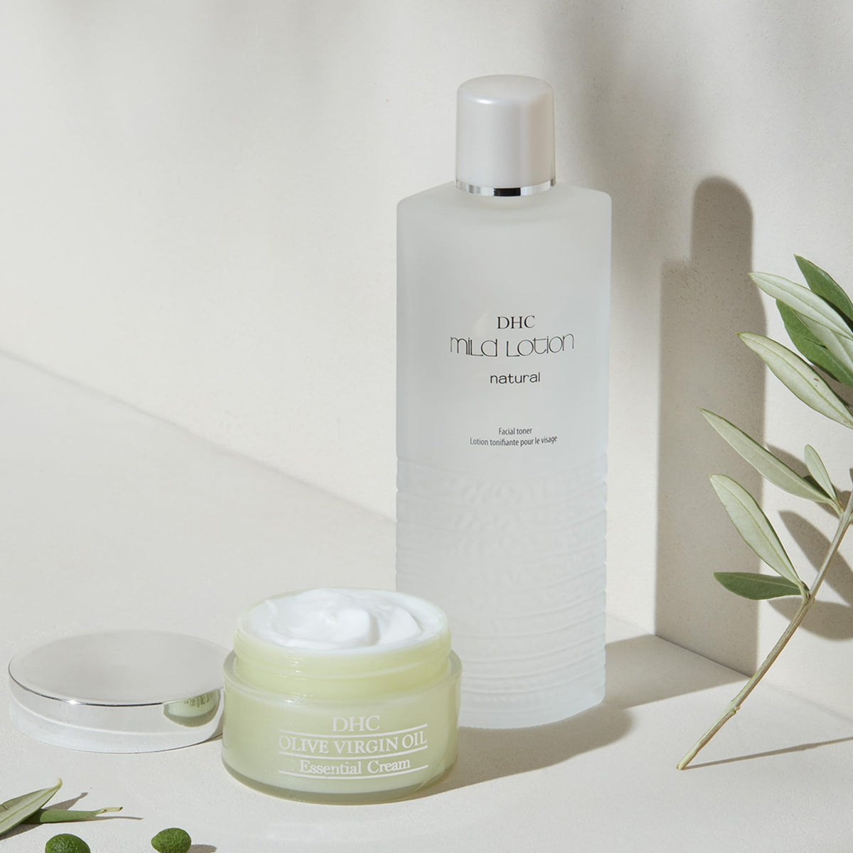 DHC Mild Lotion with other skincare items showing its prep-step role