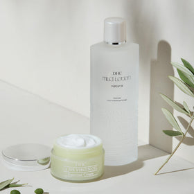 DHC Mild Lotion with other skincare items showing its prep-step role