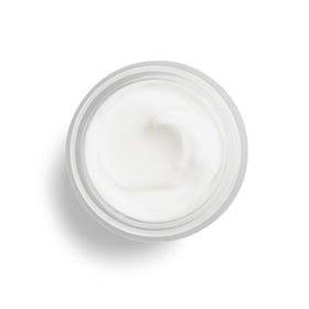 Model applying DHC cream at night illustrating easy evening routine benefit