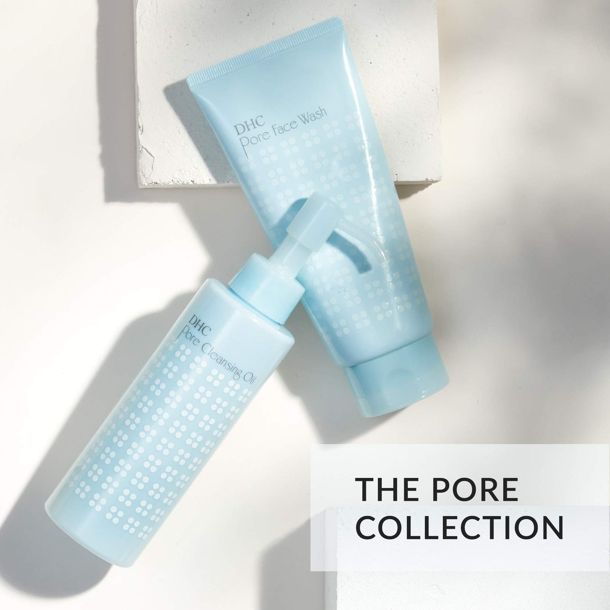 DHC 4.2 oz tube next to scale, shows compact travel-friendly size
