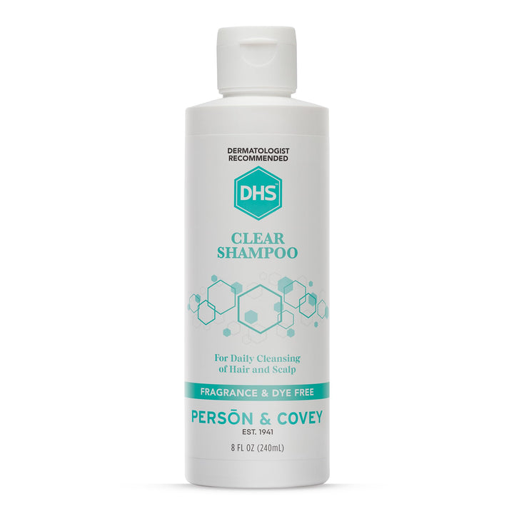 DHS clear shampoo bottle front view showing clean unscented packaging and gentle formula benefit