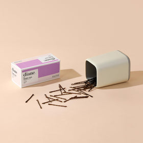 Diane pins securing an elegant updo for long-lasting hold benefit