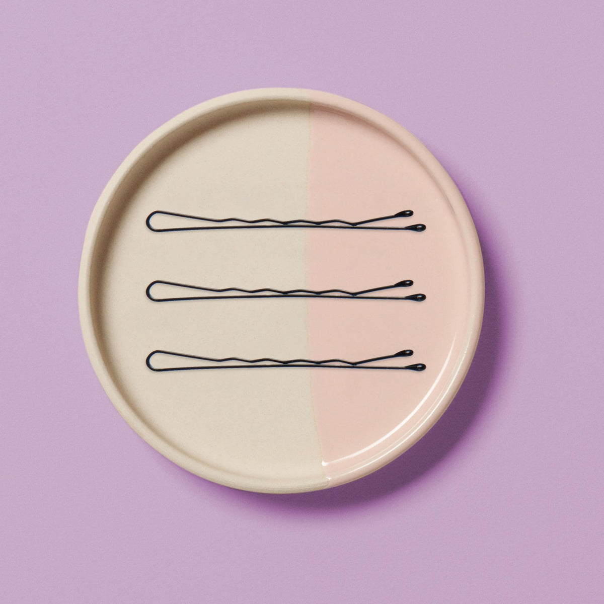 Diane bobby pin securing a bun demonstrating strong hold