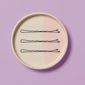 Diane bobby pin securing a bun demonstrating strong hold