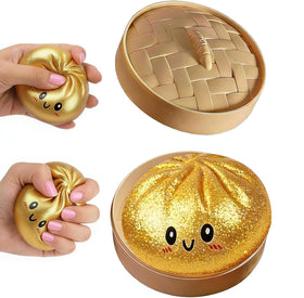 DICSINM front view of gold dumpling squishy showing shape and playful appeal