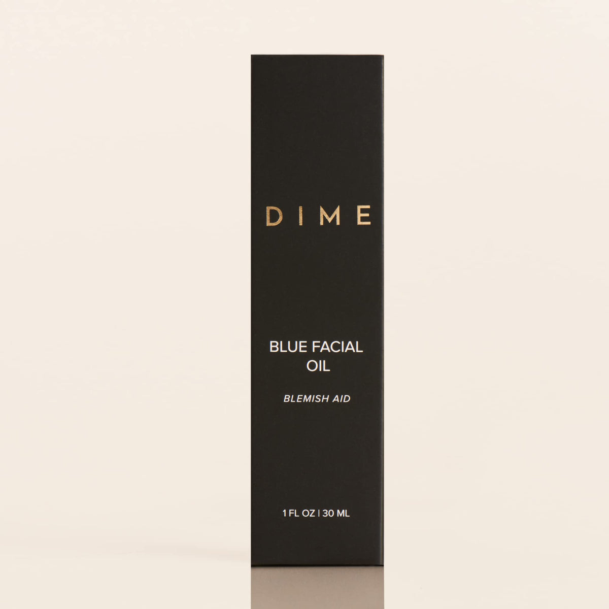 DIME applying oil directly to blemish showing targeted spot treatment benefit