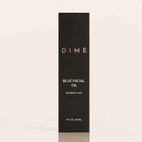 DIME applying oil directly to blemish showing targeted spot treatment benefit