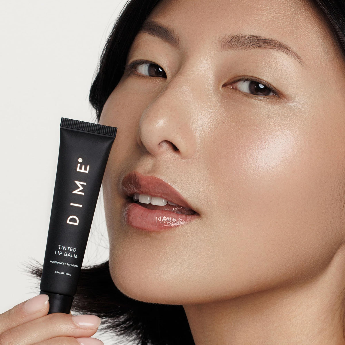 DIME Desert Rose applied on lips demonstrating sheer warm-pink tint and natural look
