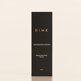 DIME Wonderscreen next to a coin to show 50g scale and convenient sizing benefit