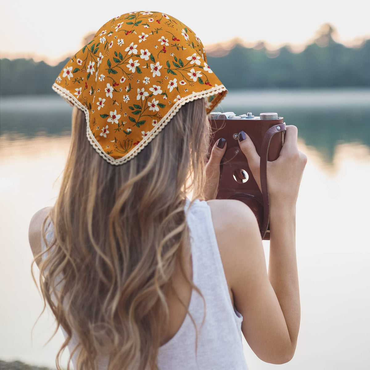 Dingion shows bandana size held by hand to demonstrate fit and coverage