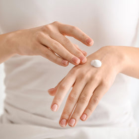 Dionis being applied to hands demonstrating fast-moisture absorption and softness